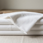 cotton bedsheets fabric weave texture and folded sheet stack explaining materials and thread count